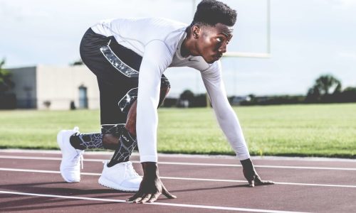 pexels-nappy-936094 sprinter in position on track